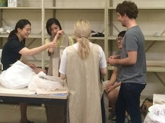 Students working on a ceramic sculptures.